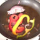 Bell peppers and onion are gently sauteed