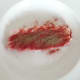 Paprika and black pepper are scattered over pork steak