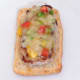 Cheesy pork steak is laid on bottom half of ciabatta