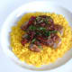 Freshly chopped mint garnishes pork vindaloo