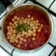 Chickpeas are added to curry sauce