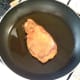 Pork steak is fried in a little oil