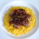 Vindaloo sauce is spooned over pork