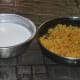 Grind soaked rice with a little coconut to make a smooth batter. Add water while grinding. Add salt to taste. This forms the outer coverings (wrappers) for the dumplings.