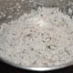 Pulse grated coconut to make uniform chunks.