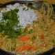 Add the grated coconut, lemon juice, sugar, roasted peanuts, and chopped coriander leaves. Mix well and turn off the fire after 30 seconds.