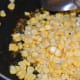 Step four: Add sweet corn. Increase the flame.