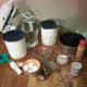 Gather your ingredients. Sugar, flour, eggs, butter, milk, baking powder, and vanilla.