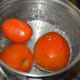 Step one: Boil 4 cups of water. Immerse ripe tomatoes in it. Cover the vessel with a lid. Turn off the stove. Keep aside for 15 minutes.