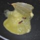 Step three: Heat a teaspoon of butter in a deep-bottomed pan. Add bay leaf and cloves. Saute for 10 seconds.