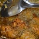 Step five: Pinch out small portions and slide them into the hot oil. Fry, turning occasionally to ensure uniform frying.