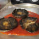 Caps grilled on both sides and laying in a layer of Marinara sauce.
