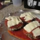 Mozzarella cheese on top of the sauce.