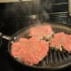 Hamburgs grilling on my grill pan.