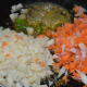 Step three: Add finely chopped vegetables (potato, garlic, onion, and carrots). I cut them in a vegetable chopper.