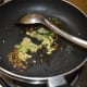 Sauté the cumin in oil until it sizzles. Throw in the ginger-garlic-green chili paste. Sauté for 30 seconds.