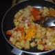 Add the turmeric powder, coriander powder, garam masala powder, and red chili powder. Add some sugar. Sauté for 2 minutes.