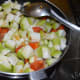 Add the chopped bottle gourd. Throw in some salt and mix well. Stir-cook for 3–4 minutes.