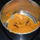 Step four: While adding water little by little, make a smooth paste. Transfer it to a bowl.