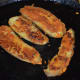 Step seven: Flip the slices. Add a few drops of oil on top. Fry until the other side is roasted and golden brown.