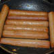 I dumped the vegetable mixture into a bowl and used the same pan to brown the sausages. Warm or cook them to your liking. I like mine quite dark.