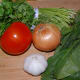 Prepare the rest of the ingredients for your dish. Mince the garlic, dice the onion, rough chop the tomato, spinach and cilantro.