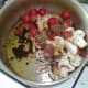 Tomato and mushroom sauce ingredients are added to a saucepan