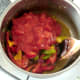Tomatoes are added to softened vegetables