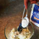 Add a pinch of salt, a pinch of pepper, and a teaspoon of flour to the leftover mashed potatoes. Mix well.