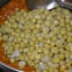 Step 9: Add cooked green peas with the stock. Stir well. Boil the mix for 1 or 2 minutes.