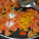 Throw in some salt and turmeric powder. Cook until tomatoes become almost mushy.