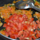 Step 5: Add chopped tomatoes.