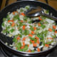 Cooking the mixed veggies.