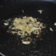 Step two: Saute garlic and ginger in oil.