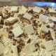 Place squares of butter on top of everything.