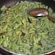 Add some water and cover the pan. Cook for 6–7 more minutes, stirring occasionally.
