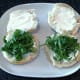 Rocket leaves laid on cream cheese spread roll bases