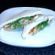Plated and served fish fingers chips and peas sandwich