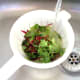 Mixed salad leaves are washed thoroughly before use