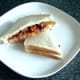 Fish fingers and spicy beans in tomato sauce sandwich
