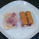 Fish fingers are laid on bacon