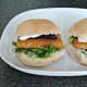 Closed over fish finger, cream cheese and rocket bread rolls
