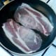 Bacon is put on to fry