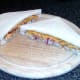 Cheese and onion fish finger sandwich is halved diagonally