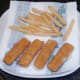 Fish fingers and chips are drained on kitchen paper