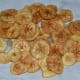 Step seven: Fry them until crispy. Remove them to an absorbent paper towel. Repeat the same for making all the chips. Sprinkle chili powder or pepper powder to make them spicy. I made salty wafers.