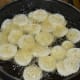 Step six: Deep-fry the slices in oil, turning occasionally. Fry them in small batches. When they are almost crispy, add a teaspoon of salt-turmeric water. You will hear a sizzling sound. It will subside in a minute.