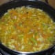 Step four: Add vegetable stock or water. Boil the mix for 3-4 minutes.
