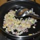 Step two: Heat oil in a deep-bottomed pan. Throw in chopped ginger, garlic, and onions. Saute them for two minutes.