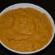 Step three: Grind them together, adding water little by little to get a near-smooth paste. Transfer this paste to a serving dish. Your spicy ridge gourd chutney is ready!